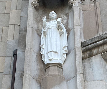 Statue on a building. Links to Gifts from Retirement Plans
