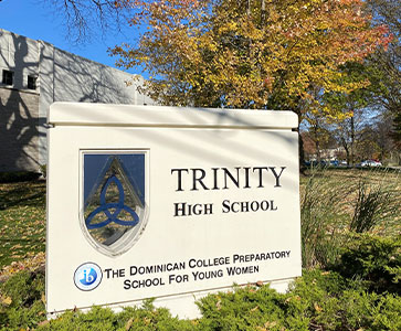 Trinity sign on campus. Links to Gifts That Pay You Income